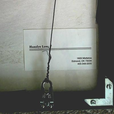 Sale Photo Thumbnail #231: This is a unique abstract raku clay art by Oklahoma mixed media and ceramics artist, Harolyn Long. Signed and framed. Frame measures 12" x 12".