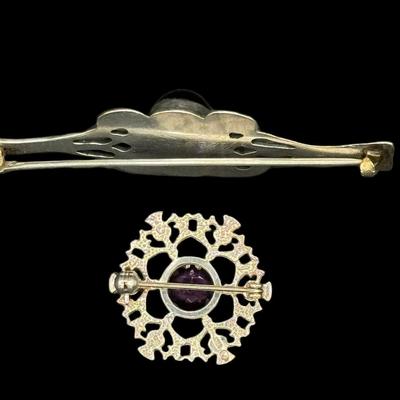 Sale Photo Thumbnail #726: **WIRE TRANSFER IS REQUIRED IF SHIPPED.** [14.62g] Includes a faceted amethyst pin, and a bezel set amethyst cabochon pin. Measurement of largest: 2.75”. Silver content confirmed using Niton XRF precious metals analyzer. **ALL PRECIOUS METALS SALES ARE 