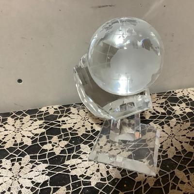 Sale Photo Thumbnail #283: This is a great crystal world paper weight with acrylic hand holder.