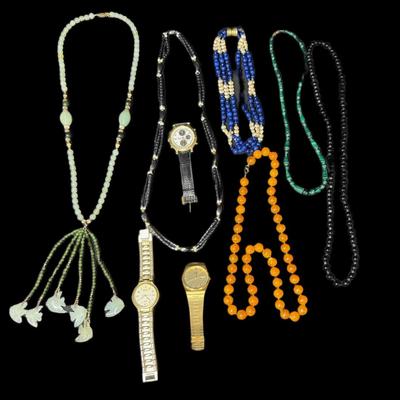 Sale Photo Thumbnail #740: Includes a Les Bernard multi-strand lapis necklace, an onyx necklace, a nephride necklace, a malachite necklace, and men’s Seiko watches. Total of nine pieces. Watches not tested. Measurement of longest piece: 14”. [CS]