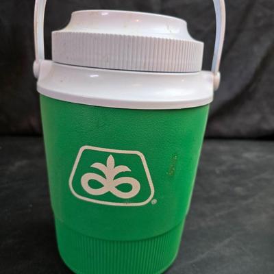 Small Rubbermaid cooler with a Gott water cooler and a thermos