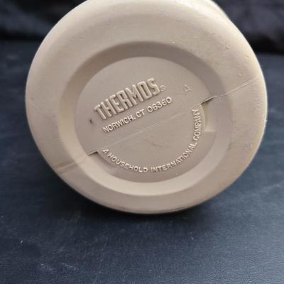 Small Rubbermaid cooler with a Gott water cooler and a thermos