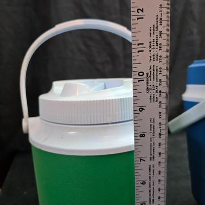 Small Rubbermaid cooler with a Gott water cooler and a thermos