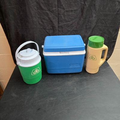 Small Rubbermaid cooler with a Gott water cooler and a thermos