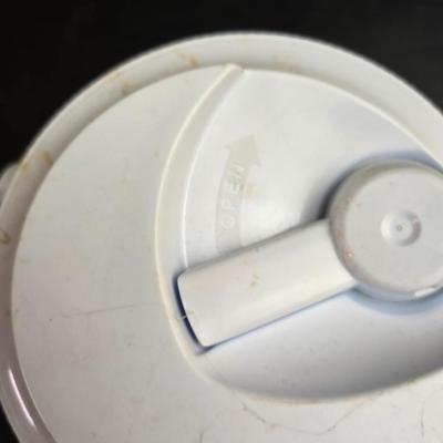 Small Rubbermaid cooler with a Gott water cooler and a thermos