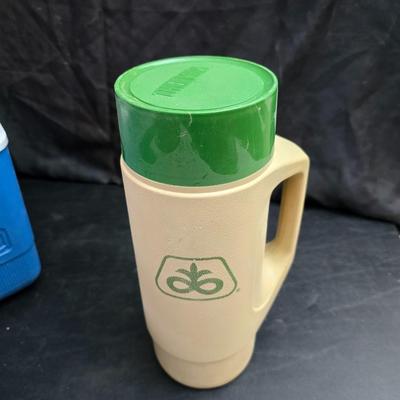 Small Rubbermaid cooler with a Gott water cooler and a thermos