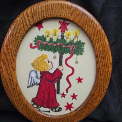 Completed and framed Paragon Needlecraft Exquisite Hummel artwork - three brass candle sticks and two Norleans Angel figures