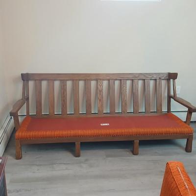 Vintage A. Brandt Ranch Oak sofa with original orange textured fabric cushions.
