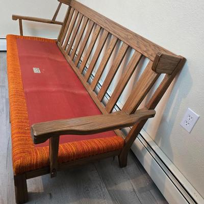 Vintage A. Brandt Ranch Oak sofa with original orange textured fabric cushions.