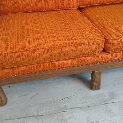 Vintage A. Brandt Ranch Oak sofa with original orange textured fabric cushions.