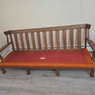 Vintage A. Brandt Ranch Oak sofa with original orange textured fabric cushions.