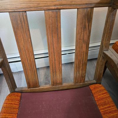 A. Brandt Ranch Oak lounge chair with orange upholstery.
