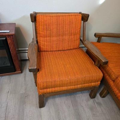 A. Brandt Ranch Oak lounge chair with orange upholstery.