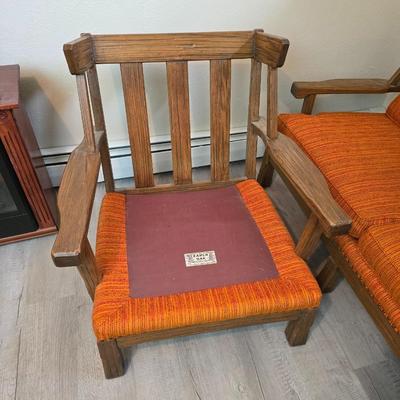 A. Brandt Ranch Oak lounge chair with orange upholstery.