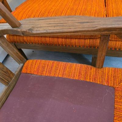 A. Brandt Ranch Oak lounge chair with orange upholstery.
