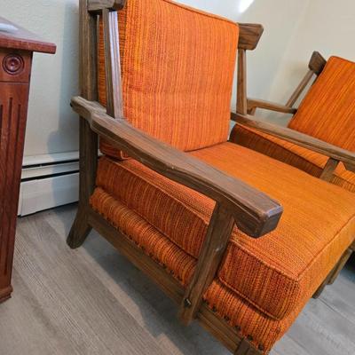 A. Brandt Ranch Oak lounge chair with orange upholstery.