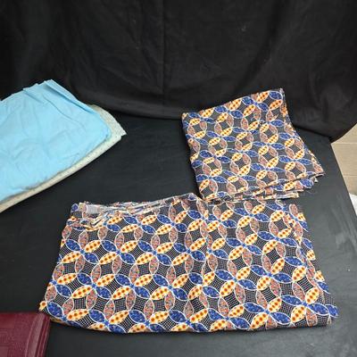 Singer button holder with large fabric scraps and vintage needles