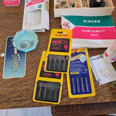 antique Singer treadle sewing machine with a wooden cabinet Complete with accessories and original manual