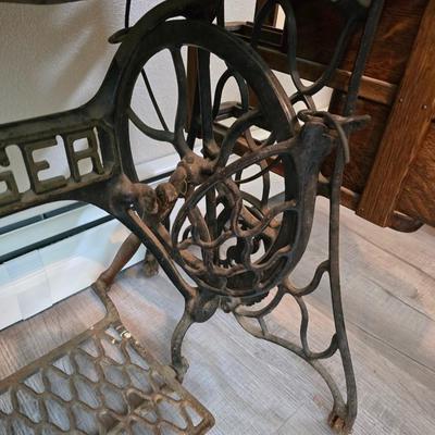 antique Singer treadle sewing machine with a wooden cabinet Complete with accessories and original manual