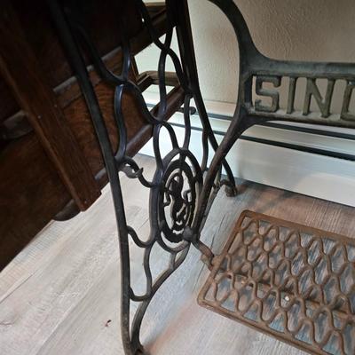 antique Singer treadle sewing machine with a wooden cabinet Complete with accessories and original manual