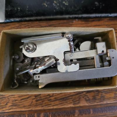 antique Singer treadle sewing machine with a wooden cabinet Complete with accessories and original manual