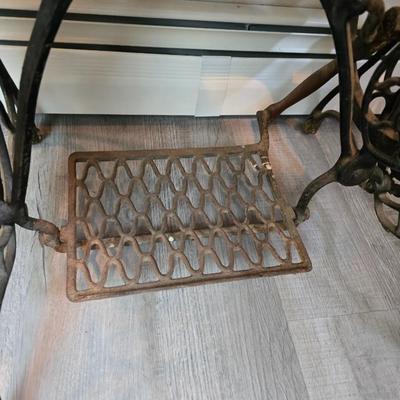 antique Singer treadle sewing machine with a wooden cabinet Complete with accessories and original manual