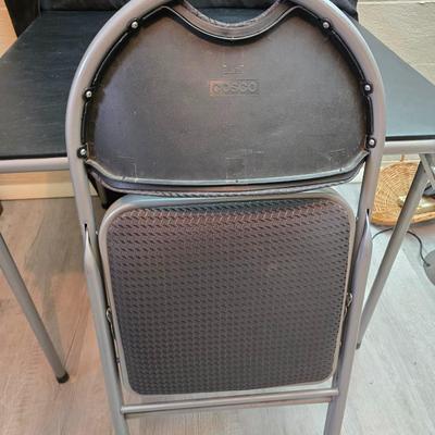 Cosco card table with black top and 4 matching folding chairs