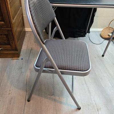 Cosco card table with black top and 4 matching folding chairs