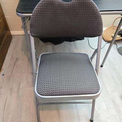 Cosco card table with black top and 4 matching folding chairs