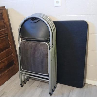 Cosco card table with black top and 4 matching folding chairs