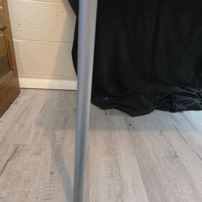 Cosco card table with black top and 4 matching folding chairs