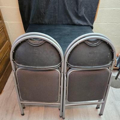 Cosco card table with black top and 4 matching folding chairs