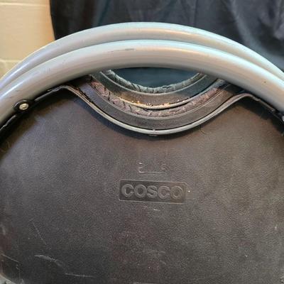 Cosco card table with black top and 4 matching folding chairs