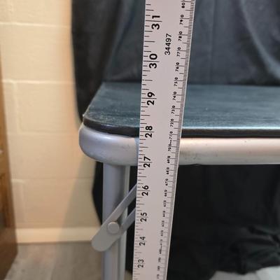 Cosco card table with black top and 4 matching folding chairs