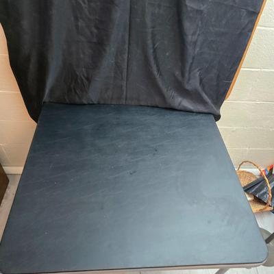 Cosco card table with black top and 4 matching folding chairs