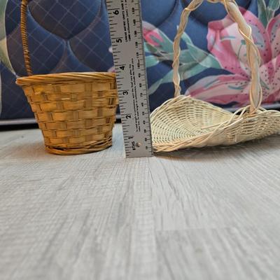 Light colored wicker baskets and a vintage macrame and beaded mirror with a frosted scene