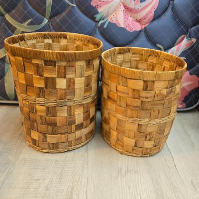 Light colored wicker baskets and a vintage macrame and beaded mirror with a frosted scene
