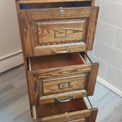 Three drawer wooden filing cabinet with a new 6 pocket expanding wallet