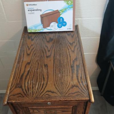 Three drawer wooden filing cabinet with a new 6 pocket expanding wallet