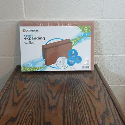 Three drawer wooden filing cabinet with a new 6 pocket expanding wallet