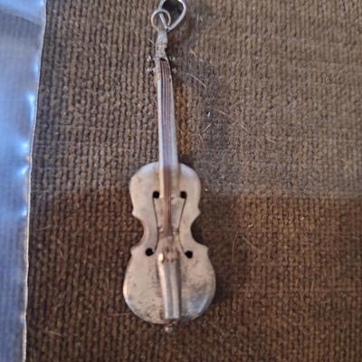 Sale Photo Thumbnail #422: We could not find a marking but this seems to be sterling,  the black parts polished off with a wet cloth and mild dish soap.