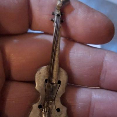 Sale Photo Thumbnail #423: We could not find a marking but this seems to be sterling,  the black parts polished off with a wet cloth and mild dish soap.