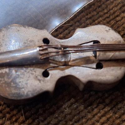 Sale Photo Thumbnail #424: We could not find a marking but this seems to be sterling,  the black parts polished off with a wet cloth and mild dish soap.