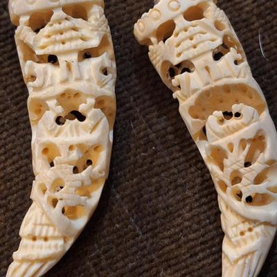 Sale Photo Thumbnail #430: set of 2 carved hippos teeth- we aren't sure how to verify this- they are part of an estate and simply were in a Ziplock back labeled hippo.  It looks like they seller might have paid $400 for them in the 70s or 80s from the scribbled notes- but again…w