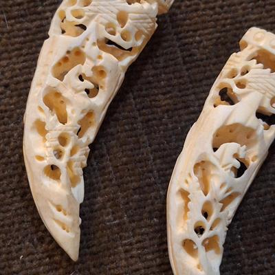 Sale Photo Thumbnail #427: set of 2 carved hippos teeth- we aren't sure how to verify this- they are part of an estate and simply were in a Ziplock back labeled hippo.  It looks like they seller might have paid $400 for them in the 70s or 80s from the scribbled notes- but again…w