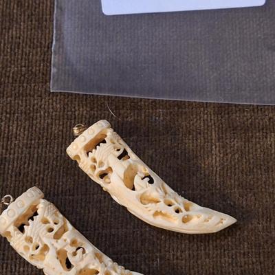 Sale Photo Thumbnail #426: set of 2 carved hippos teeth- we aren't sure how to verify this- they are part of an estate and simply were in a Ziplock back labeled hippo.  It looks like they seller might have paid $400 for them in the 70s or 80s from the scribbled notes- but again…w