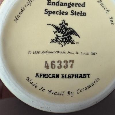 Handcrafted Endangered Species Steins "Gray Wolf & African Elephant"
