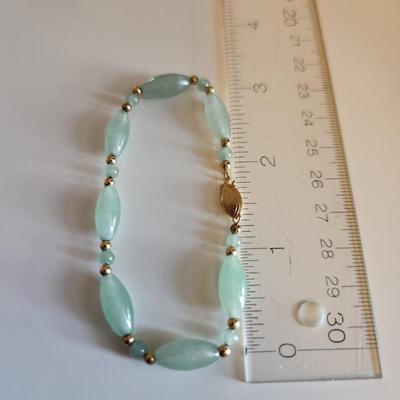 Sale Photo Thumbnail #240: This auction lot is for a Jade & 14K Gold Bracelet with a pair of Elephant Earrings.  This handsome luxury accessory is quite the tourist piece.  Both the bracelet and the earrings are marked 14K.