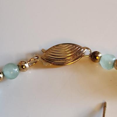 Sale Photo Thumbnail #239: This auction lot is for a Jade & 14K Gold Bracelet with a pair of Elephant Earrings.  This handsome luxury accessory is quite the tourist piece.  Both the bracelet and the earrings are marked 14K.