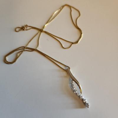 Sale Photo Thumbnail #245: This auction lot is for a 14K Gold & Diamond Necklace.  The necklace measures about 24-inches and is marked 14K. The stunning pendant is marked 14K and has eight chip stones tested as diamond.  This nifty item weighs about 5.1 grams by our scale.